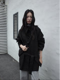 Person wearing a black Stand-up Collar Mid-Length Trench Coat standing against a plain wall.