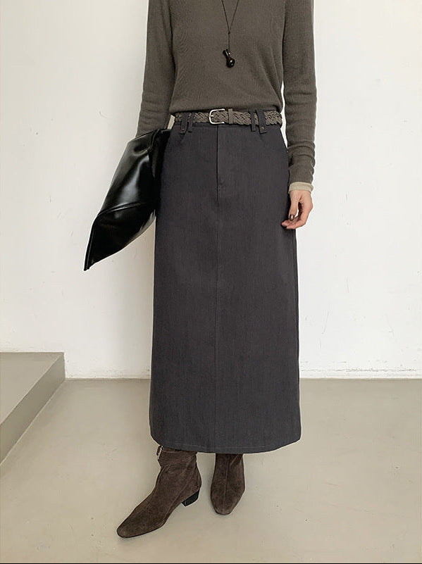 Person wearing a long dark gray High-waisted A-line Maxi Skirt with a plain background