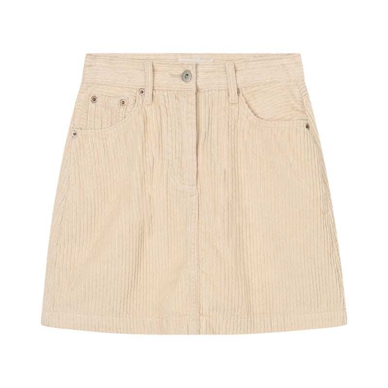 Beige corduroy mini skirt on a white background